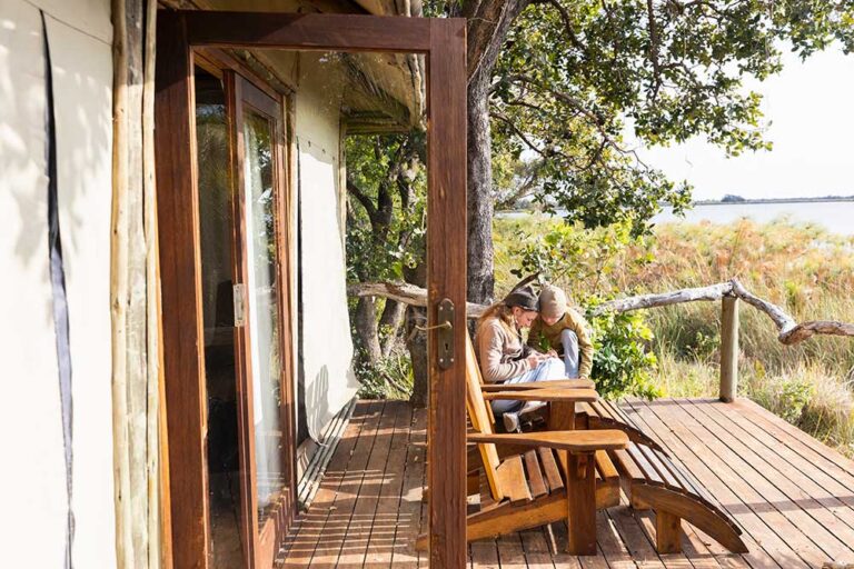 mother-and-child-on-wooden-decking-outdoors-South African Safari Blog | Deon Burger Safaris