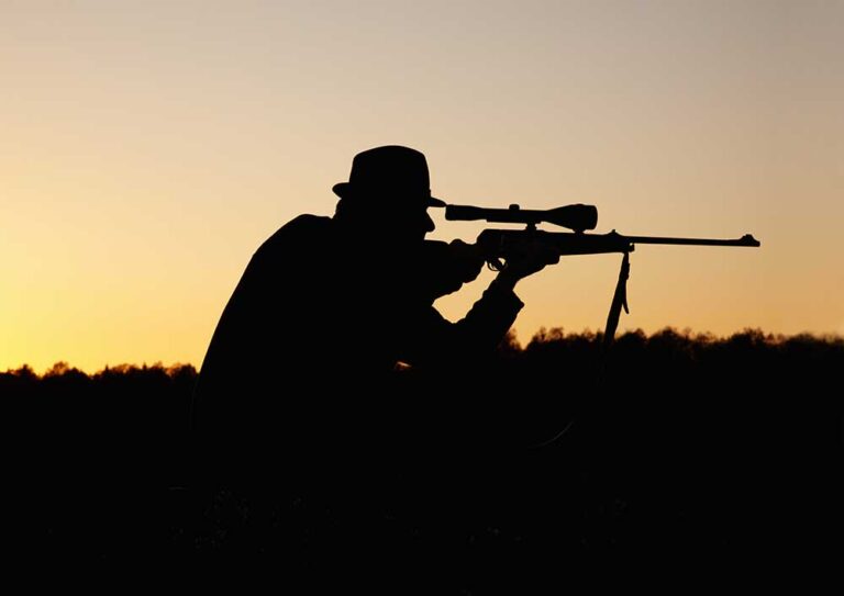 Hunting Safaris | Premium Plains Game Hunting In Africa. silhouette-of-hunter-aiming-rifle-at-sunset